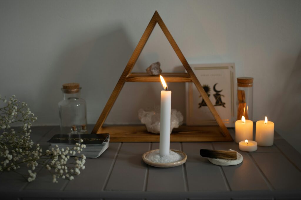 pexels photo 20431432 20431432 A serene spiritual setup featuring candles, crystals, and tarot cards arranged for meditation.